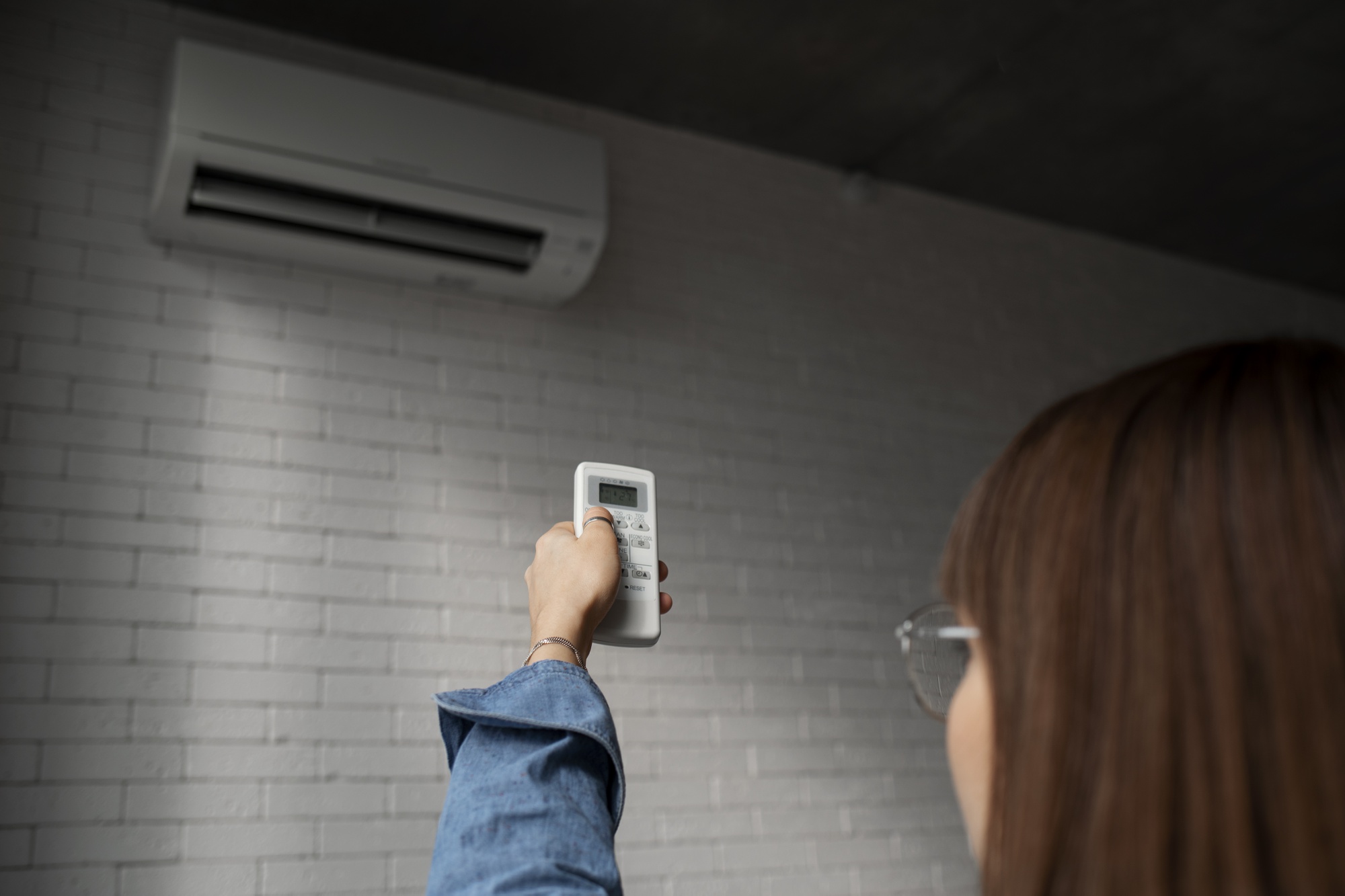 Adjusting heat pump remote in New Hampshire home