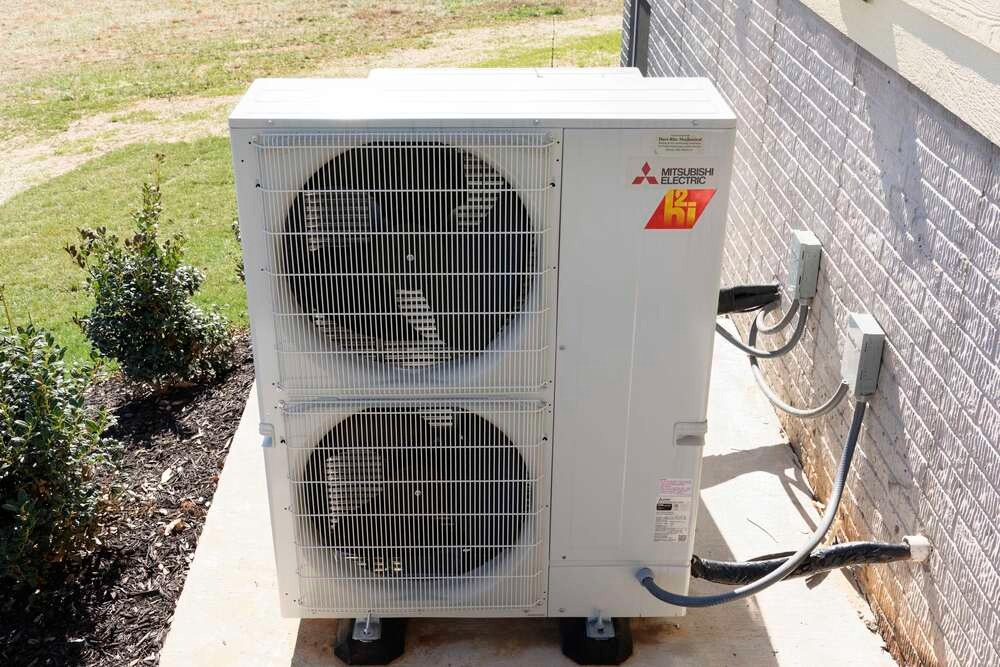 Mitsubishi Electric heat pump outside house