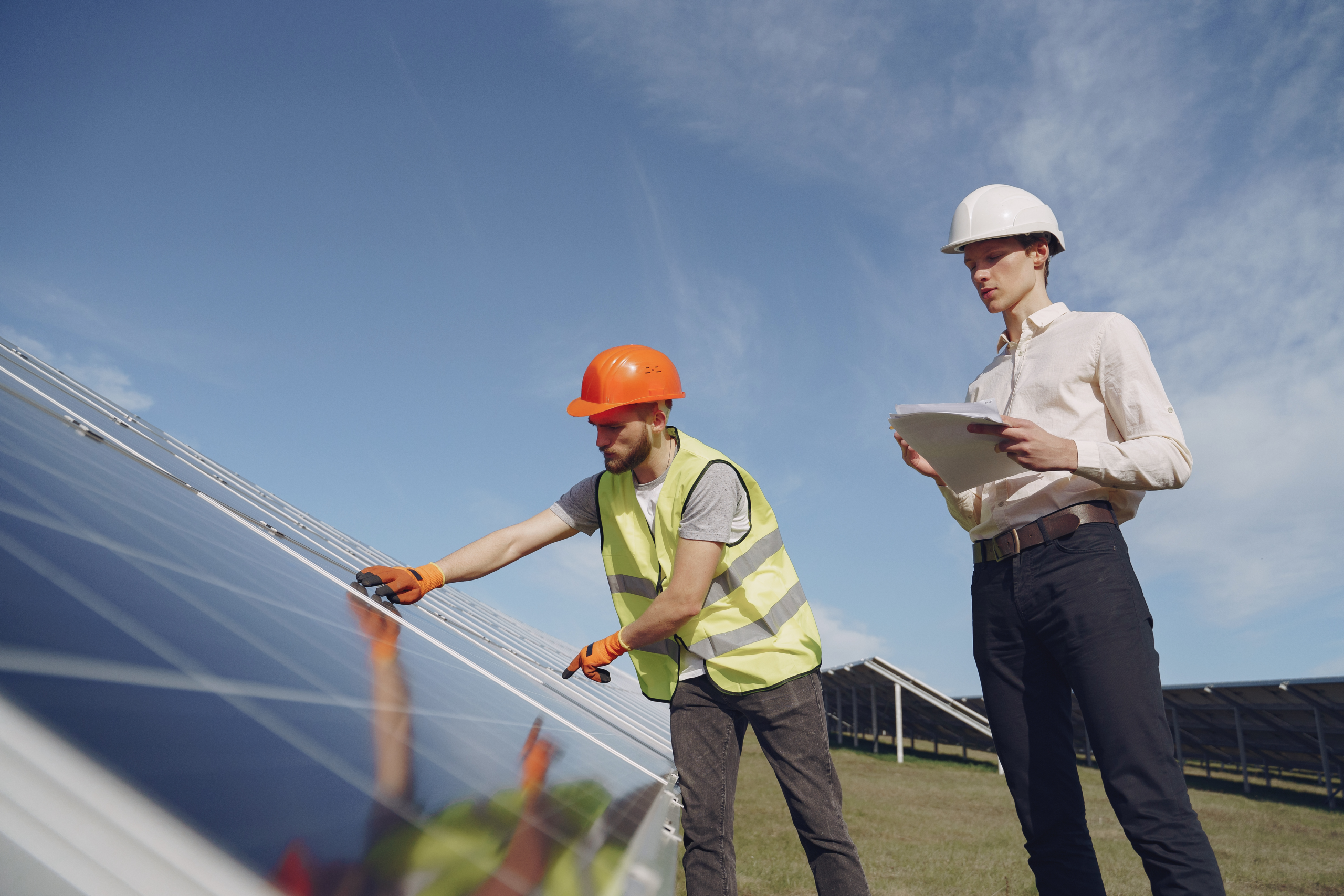 Vermont HVAC technicians inspecting solar panels
