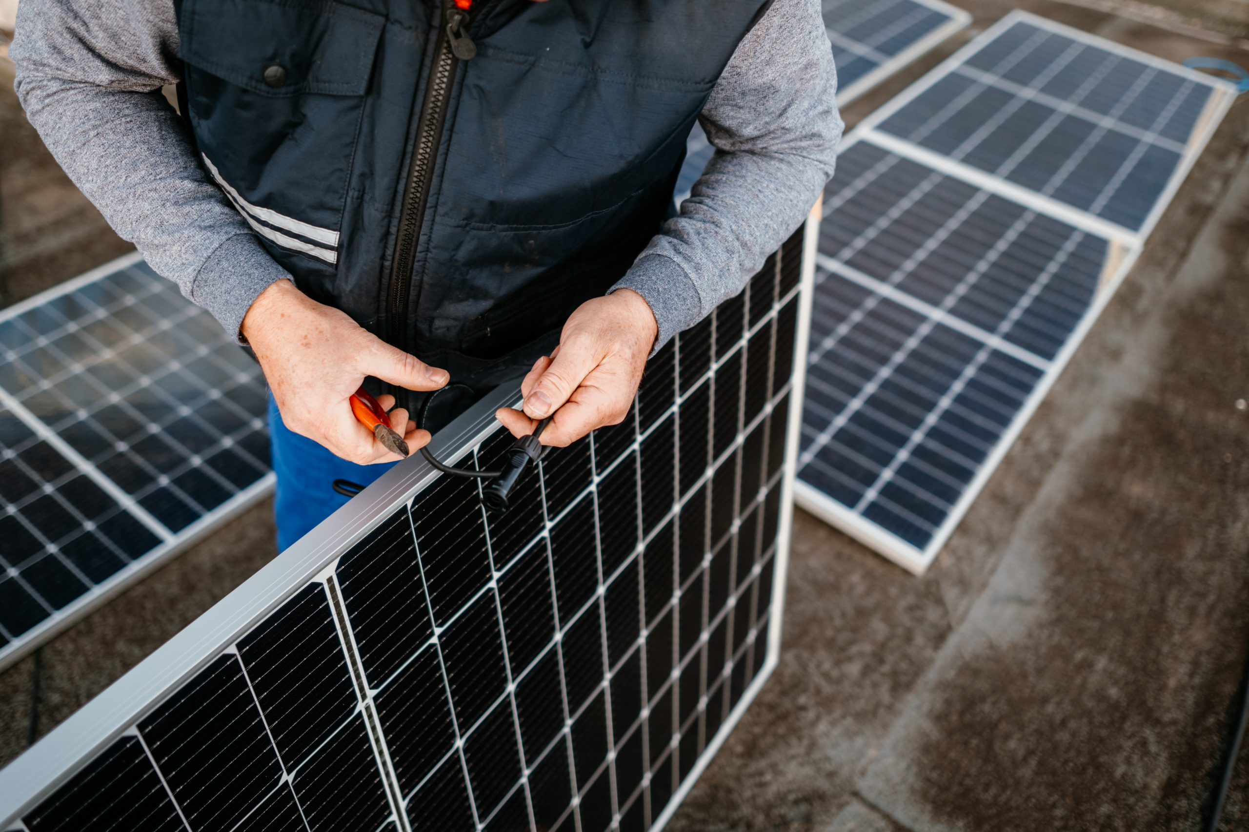 Vermont HVAC technician repairing solar panel wiring