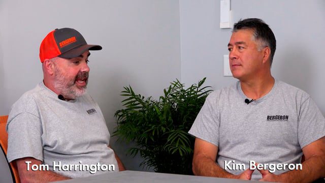 Men discussing heat pump installation New Hampshire