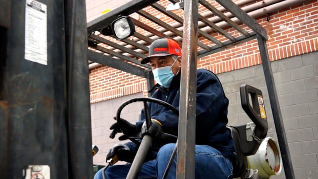 Forklift operator at heat pump installation site