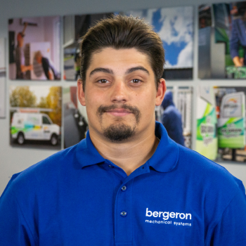 Vermont HVAC technician in blue shirt