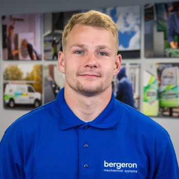 Vermont HVAC technician in blue shirt indoors