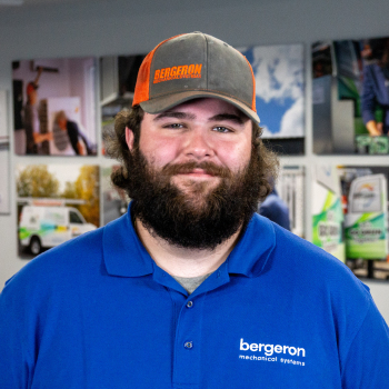 Bergeron technician smiling mini-split installation New Hampshire