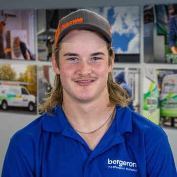 Vermont HVAC technician smiling in uniform