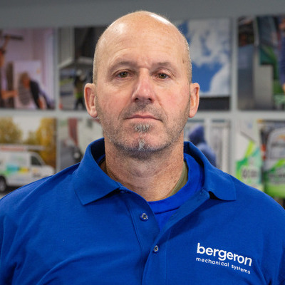 Vermont HVAC technician in blue uniform