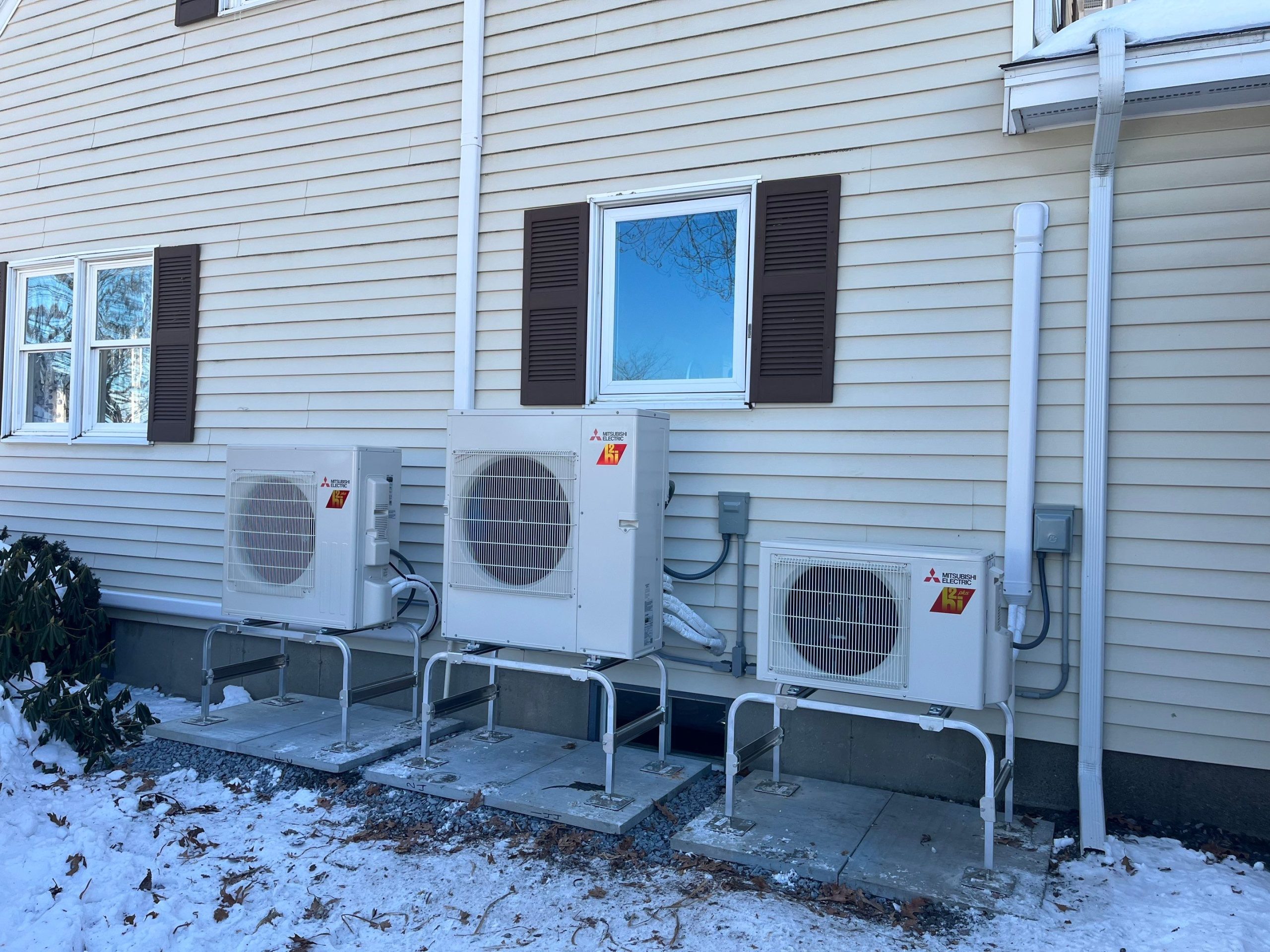 Vermont HVAC outdoor units on metal stands