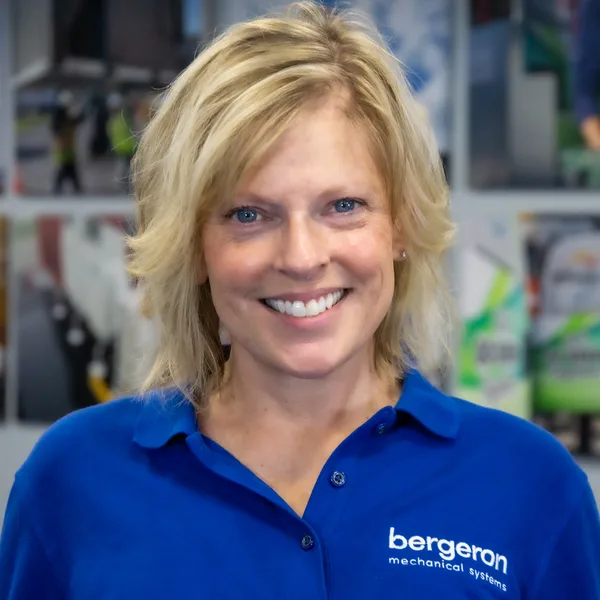 Woman smiling in Bergeron Mechanical Systems shirt